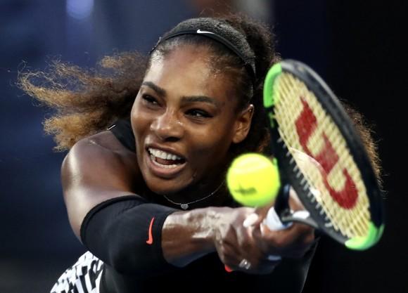 United States' Serena Williams makes a backhand return to her sister Venus during the women's singles final at the Australian Open tennis championships in Melbourne, Australia, on Jan. 28, 2017. (AP Photo/Aaron Favila)