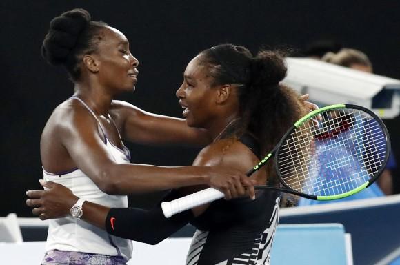 United States' Serena Williams, right, and her sister Venus, left, embrace after Serena won the women's singles final at the Australian Open tennis championships in Melbourne, Australia, on Jan. 28, 2017. (AP Photo/Kin Cheung)