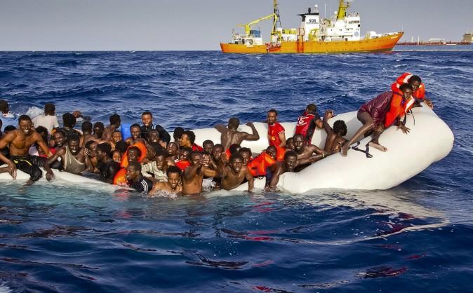 Migrants on an overcrowded boat call for help off the coast of the Italian island of Lampedusa on April 17, 2016. (Patrick Bar/SOS Mediterranee via AP)