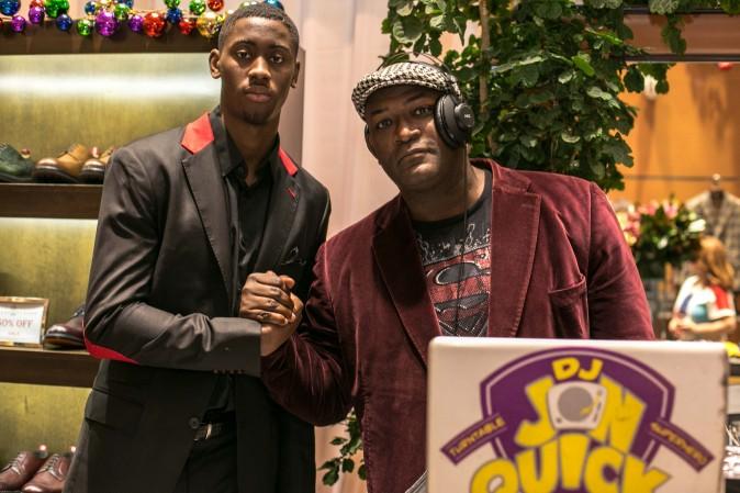 Brooklyn Net Caris LeVert with DJ Jon Quick at the Eredi Pisanò boutique celebrating 15 years on Madison Avenue in New York on Dec. 21, 2016. (Benjamin Chasteen/Epoch Times)