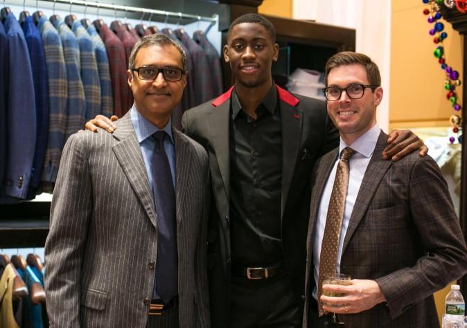 Brand ambassador Brooklyn Net Caris LeVert (C) along with attending guests at the Eredi Pisanò boutique event which is celebrating 15 years on Madison Avenue in New York on Dec. 21, 2016. (Benjamin Chasteen/Epoch Times)