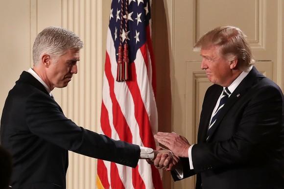 President Donald Trump (R) shakes hands with Judge Neil Gorsuch after nominating him to the Supreme Court during a ceremony in the East Room of the White House in Washington, DC Jan. 31, 2017. (Chip Somodevilla/Getty Images)