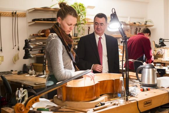 Elizabeth LaPorte and co-founder Bruno Price at the restoration shop of Rare Violins of New York in Manhattan, New York, on Jan. 9, 2017. (Samira Bouaou/Epoch Times)