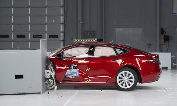 This Sept. 15, 2016, photo provided by the Insurance Institute for Highway Safety shows a Tesla Model S during crash safety testing. (Matt Daly/Insurance Institute for Highway Safety via AP)