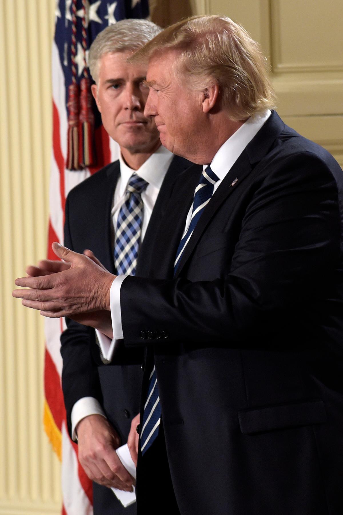 President Donald Trump and Judge Neil Gorsuch during a televised address from the East Room of the White House in Washington on Jan. 31, 2017. (AP Photo/Susan Walsh)