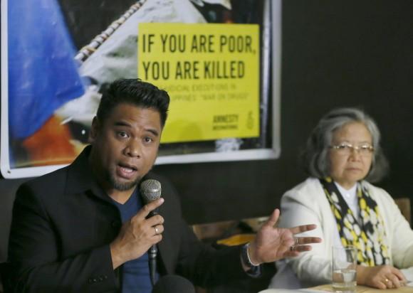 Amnesty International campaigner Wilnor Papa, left, gestures during a video news conference with their London counterpart Rachel Chhoa-Howard and Sis. Maria Vida Cordero, right, in suburban Quezon city, northeast of Manila, Philippines.  (AP Photo/Bullit Marquez)