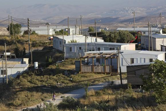 In this file photo, buildings in Amona, an unauthorized Israeli outpost in the West Bank, east of the Palestinian town of Ramallah. (AP Photo/Oded Balilty)