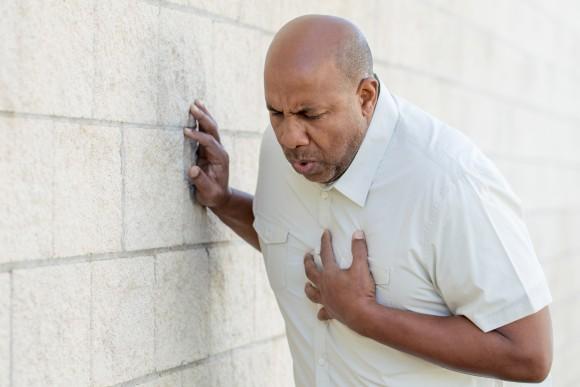 The primary symptoms of unstable angina are chest pain that can feel like pressure, tightness, heaviness, or squeezing. (363299582/Shutterstock)