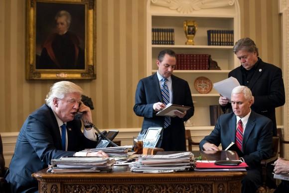 President Donald Trump speaks on the phone with Russian President Vladimir Putin in the Oval Office of the White House in Washington on, Jan. 28, 2017. Also pictured, from left, White House Chief of Staff Reince Priebus, Vice President Mike Pence, and White House Chief Strategist Steve Bannon. (Drew Angerer/Getty Images)
