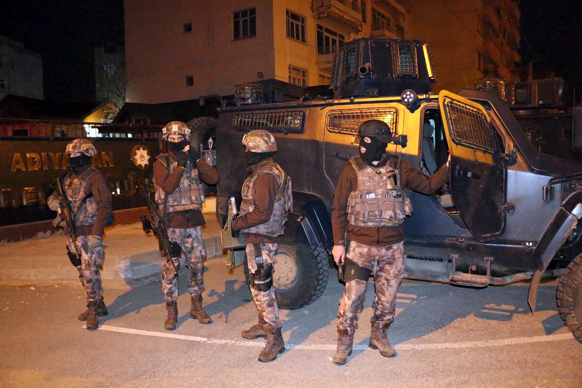 Turkish anti-terrorism police stand by their armoured vehicle during an operation to arrest people over alleged links to ISIS, in Adiyaman, southeastern Turkey on Feb. 5, 2017. (Mahir Alan/Dha-Depo Photos via AP)