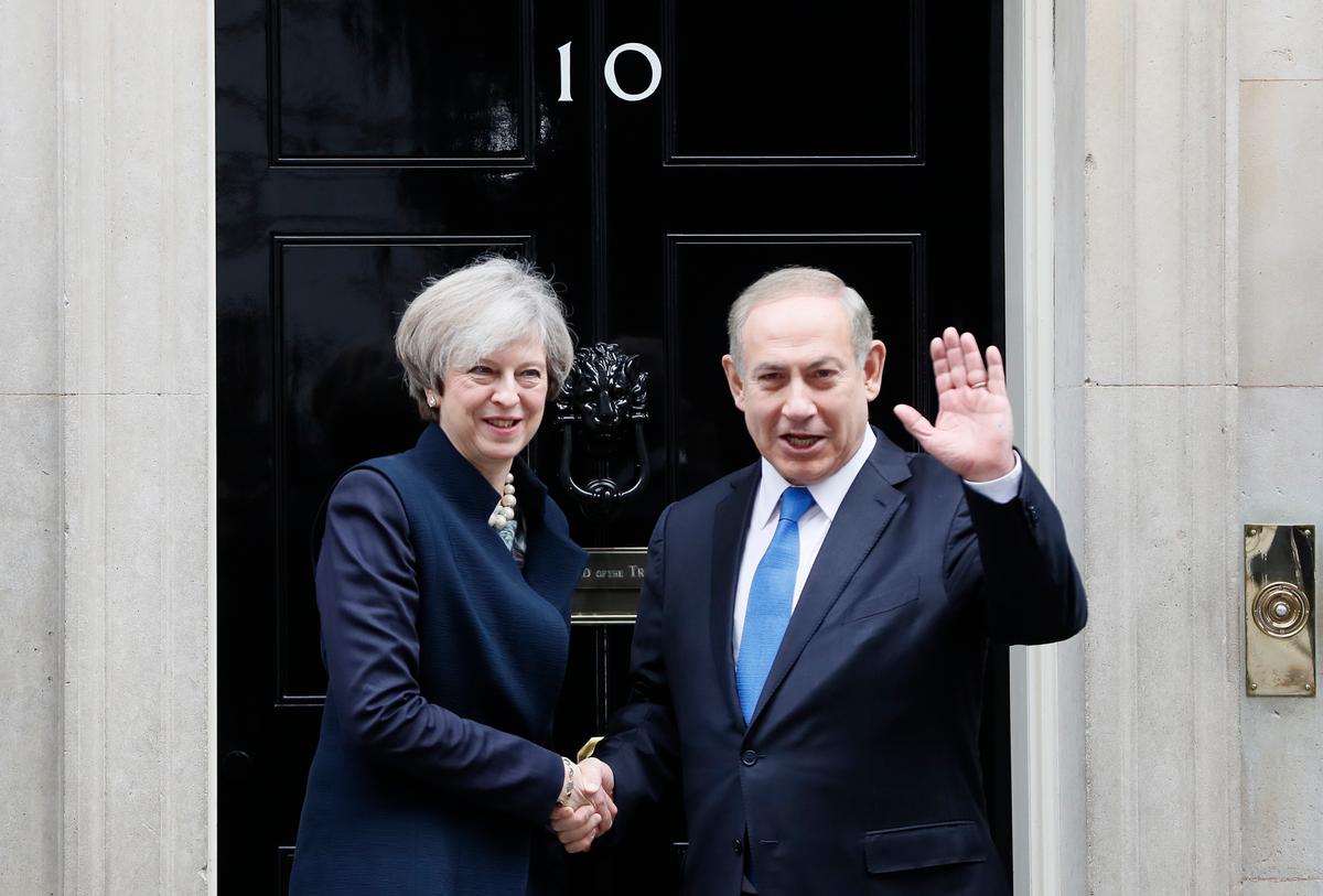 Britain's Prime Minister Theresa May greets Prime Minister Benjamin Netanyahu of Israel at Downing Street in London on Feb. 6, 2017. (AP Photo/Kirsty Wigglesworth)