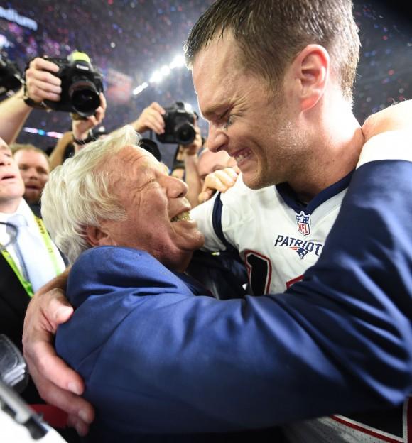 New England Patriots owner Robert Kraft and Tom Brady #12 of the New England Patriots celebrate after defeating the Atlanta Falcons during Super Bowl 51 at NRG Stadium in Houston, Texas on Feb. 5, 2017. The Patriots defeated the Falcons 34-28 after overtime. (TIMOTHY A. CLARY/AFP/Getty Images)