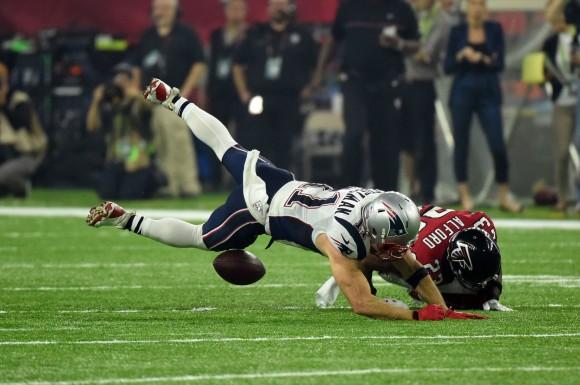 Robert Alford #23 of the Atlanta Falcons tackles Julian Edelman #11 of the New England Patriots in the first quarter of Super Bowl 51 at NRG Stadium in Houston, Texas on Feb. 5, 2017. (TIMOTHY A. CLARY/AFP/Getty Images)