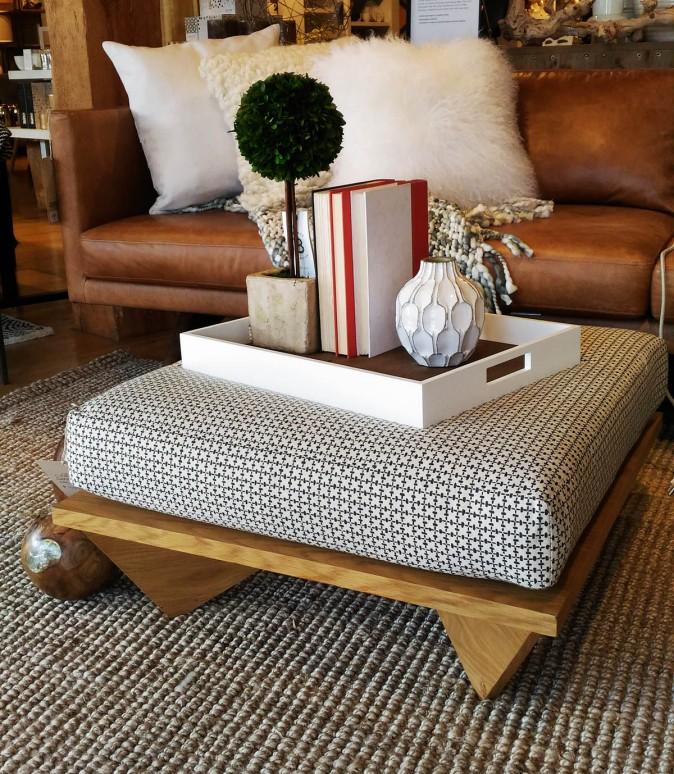 A cushioned coffee table can double as extra seating or as a footstool. (Epoch Times)