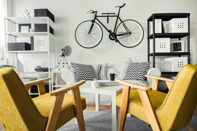 Storing a bicycle on the wall is aesthetically pleasing and also frees up floor space. (Photographee.eu/Shutterstock)