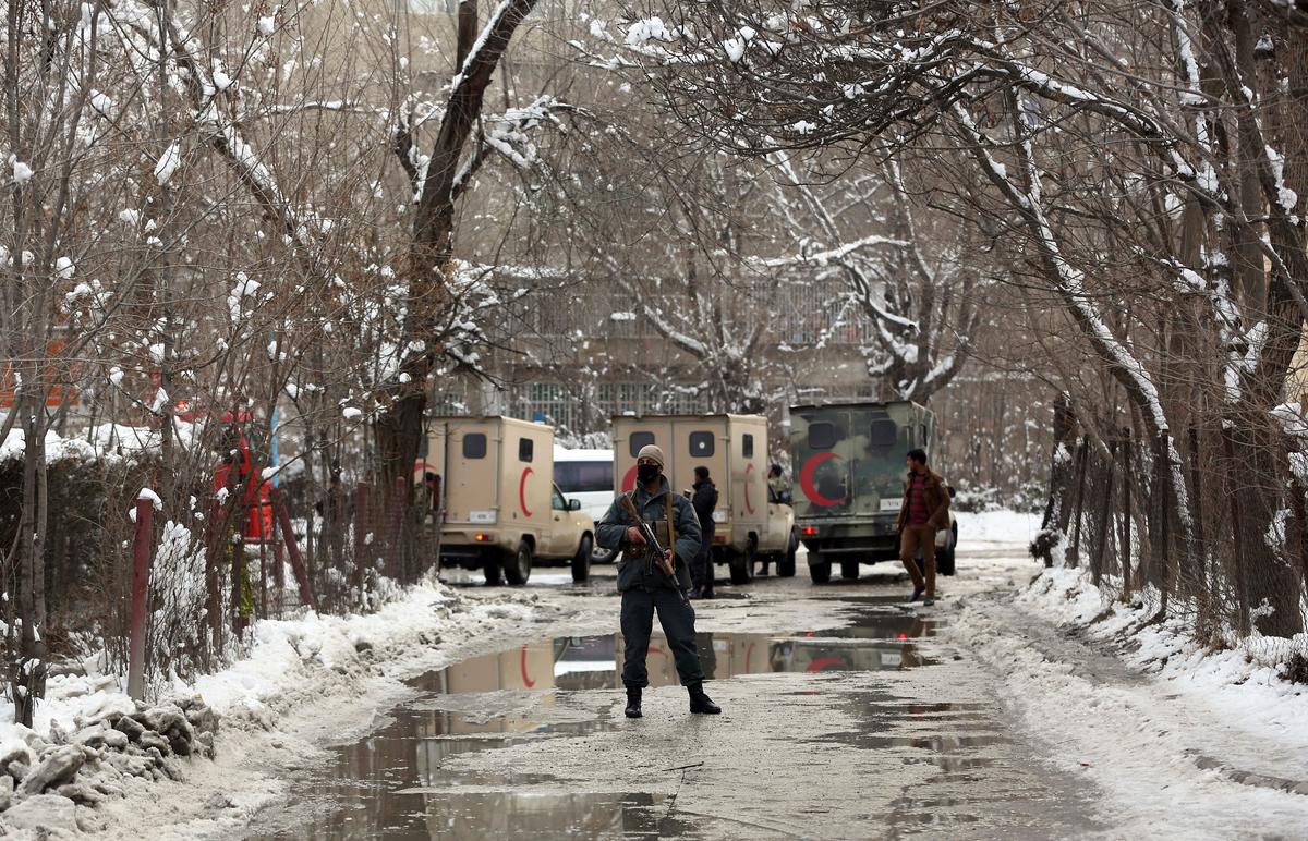 Security forces stand guard at the site of a a suicide attack on the Supreme Court in Kabul, Afghanistan on Feb. 7, 2017. (AP Photos/Massoud Hossaini)
