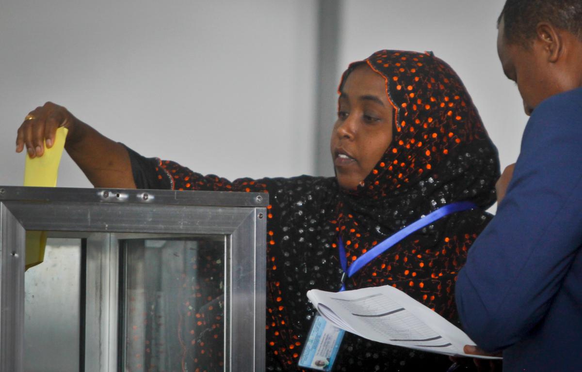 An unidentified Somali member of parliament casts her vote for the presidential election in Mogadishu, Somalia Wednesday, Feb. 8, 2017. (AP Photo/Farah Abdi Warsameh)