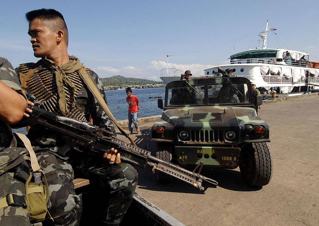 Soldiers patrol along the wharf in Basilan island during an anti-kidnap operation on Feb. 18, 2009. (THERENCE KOH/AFP/Getty Images)