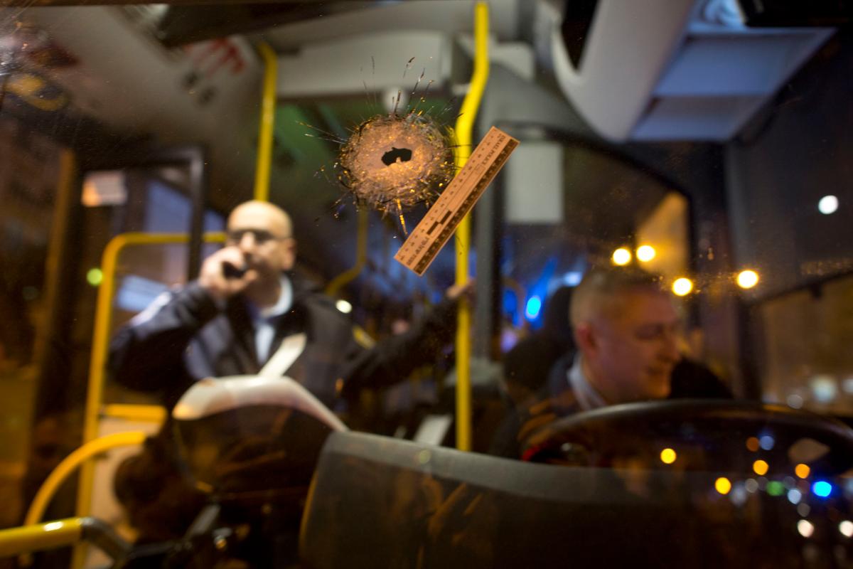 A bullet hole is seen on the windshield of a bus at the scene of a shooting attack in Petah Tikva, Israel on Feb. 9, 2017. (AP Photo/Oded Balilty)