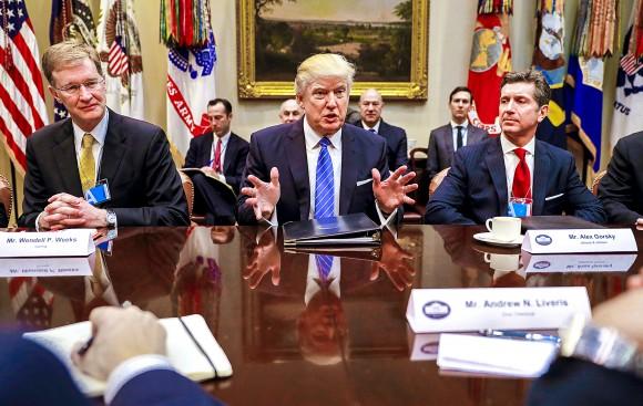 President Donald Trump (C), CEO of Johnson & Johnson Alex Gorsky (R), and CEO of Corning Wendell P. Weeks (L) at a breakfast meeting with business leaders at the White House on Jan. 23. Established in 1851, Corning continues to invest in innovation and manufacturing in the United States. (AP Photo/Pablo Martinez Monsivais)