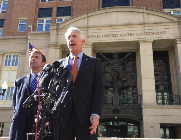 Virginia Attorney General Mark Herring, right, accompanied by Virginia Solicitor General Stuart Raphael, speaks outside the federal courthouse in Alexandria, Va. on Feb. 10, 2017, following a hearing on President Donald Trump's travel ban. (AP Photo/Jessica Gresko)