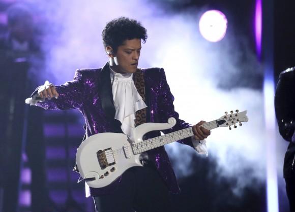 Bruno Mars performs "Let's Go Crazy" during a tribute to Prince at the 59th annual Grammy Awards on Sunday, Feb. 12, 2017, in Los Angeles. (Photo by Matt Sayles/Invision/AP)