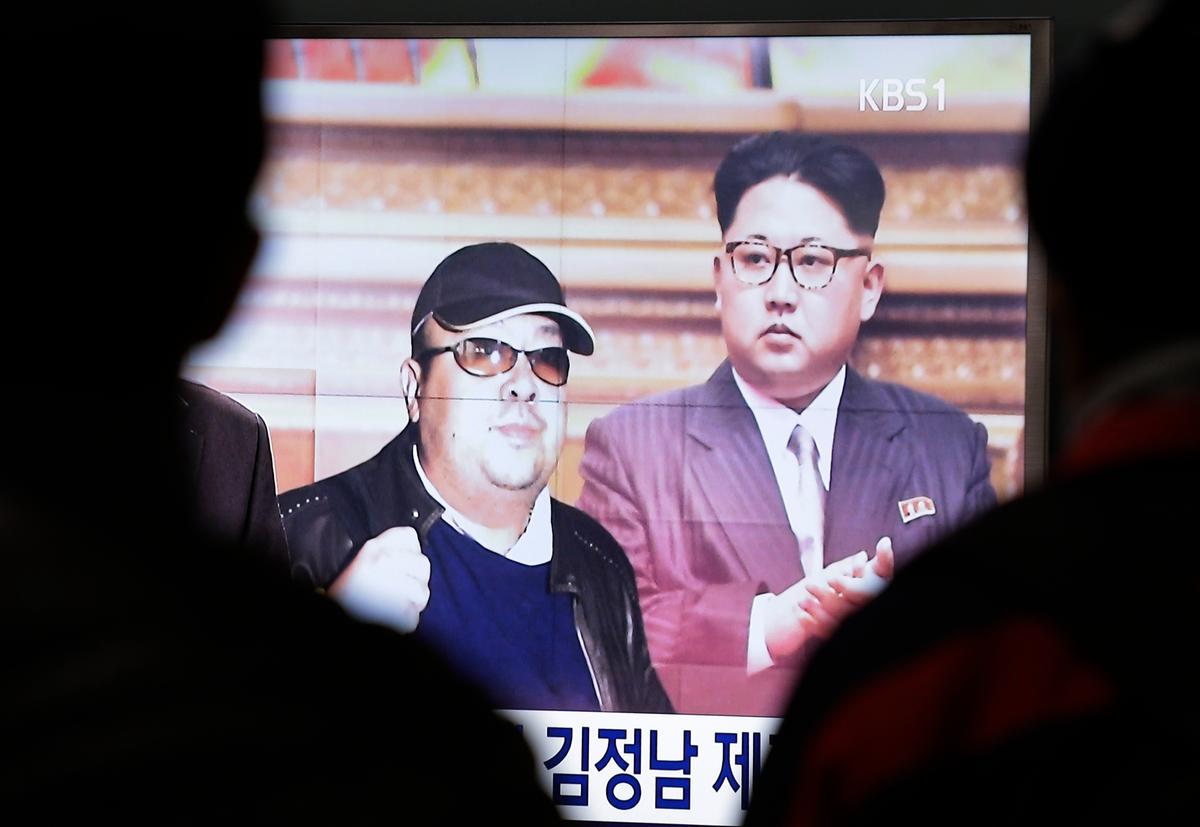 A TV screen shows pictures of North Korean leader Kim Jong Un and his older brother Kim Jong Nam (L) at the Seoul Railway Station in Seoul, South Korea on Feb. 14, 2017. (AP Photo/Ahn Young-joon)