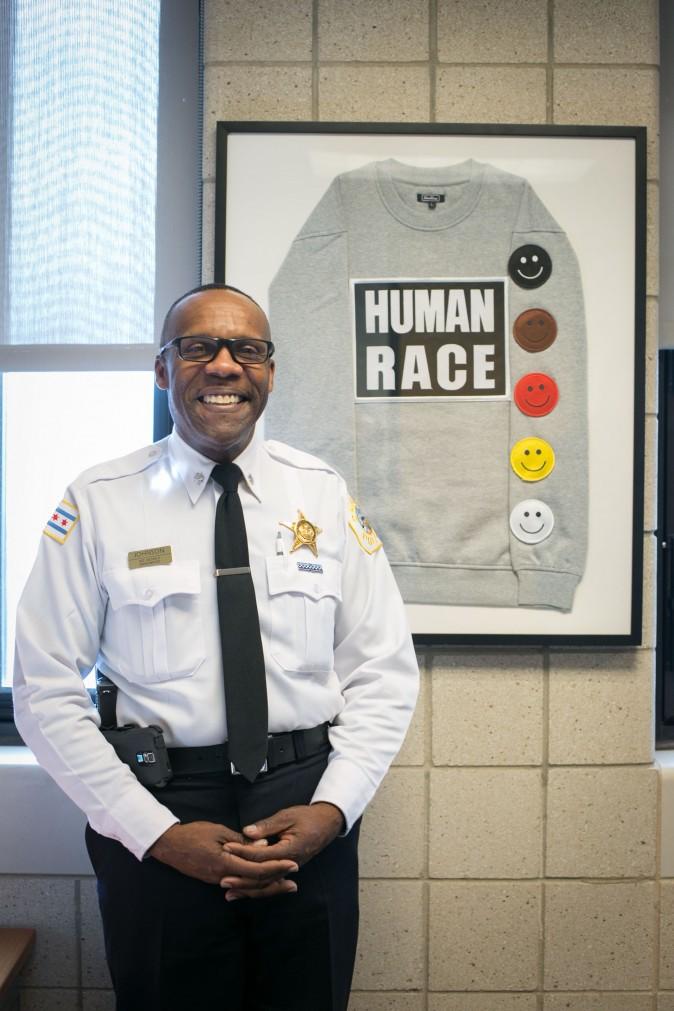 Commander Kenneth Johnson of the District 7 Chicago Police Station in Englewood, Chicago, on Feb. 2, 2017, with a sweater he purchased at a street fair. (Benjamin Chasteen/Epoch Times)
