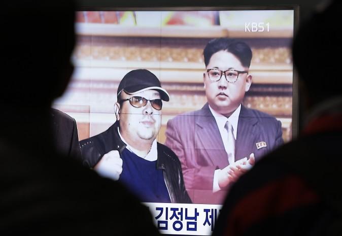 North Korean leader Kim Jong Un and his older brother Kim Jong Nam (L) on a news program at the Seoul Railway Station in Seoul, South Korea, on Feb. 14, 2017. (AP Photo/Ahn Young-joon)