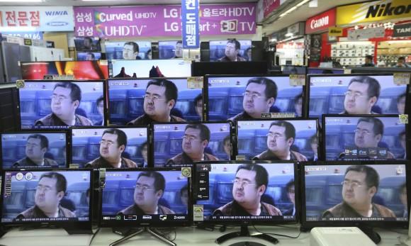 TV screens show pictures of Kim Jong Nam, the half-brother of North Korean leader Kim Jong Un, at an electronic store in Seoul, South Korea, on Feb. 15, 2017. (AP Photo/Ahn Young-joon)