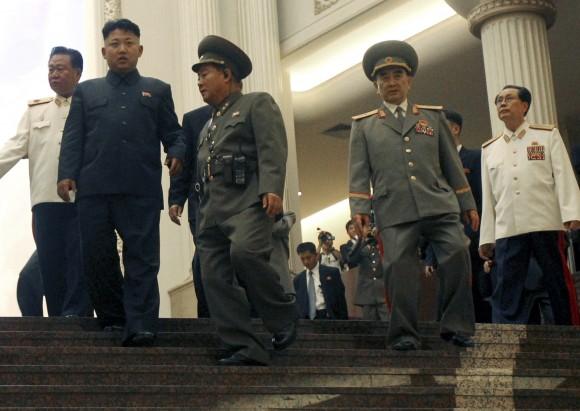 In this file photo, North Korean leader Kim Jong Un, second left, tours the newly-opened Fatherland Liberation War Museum, with his uncle Jang Song Thaek, right, Yang Hyong Sop, second right, vice president of the Presidium of North Korea's parliament, and Vice Marshal Choe Ryong Hae, left, as part of celebrations for the 60th anniversary of the Korean War armistice in Pyongyang. (AP Photo/Wong Maye-E)