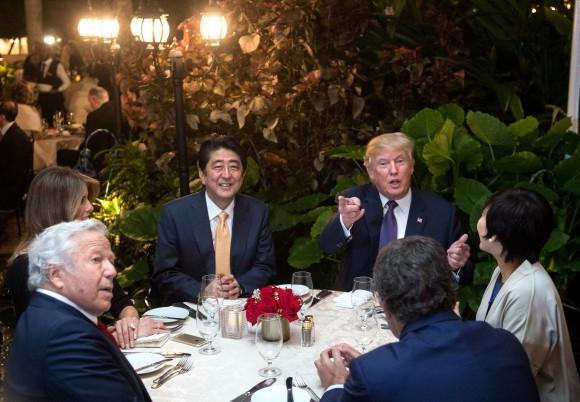 President Donald Trump, Japanese Prime Minister Shinzo Abe (2nd-L), his wife Akie Abe (R), US First Lady Melania Trump (L) and Robert Kraft (2nd-L),owner of the New England Patriots, sit down for dinner at Trump's Mar-a-Lago resort on Feb. 10, 2017. (NICHOLAS KAMM/AFP/Getty Images)