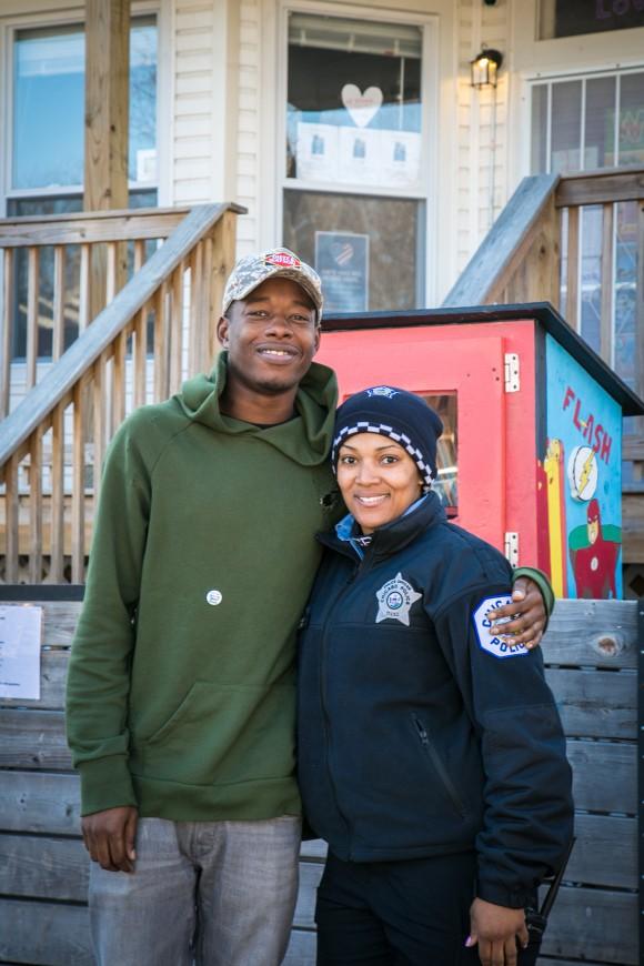 Karl Mables with Officer Janice Wilson in front of the I Grow Chicago Peace House which has free supplies, food, and offers classes for children in Englewood, Chicago, on Feb. 3, 2017. Mables was a former gang member who is now preparing to enlist in the Chicago Police Department. (Benjamin Chasteen/Epoch Times)
