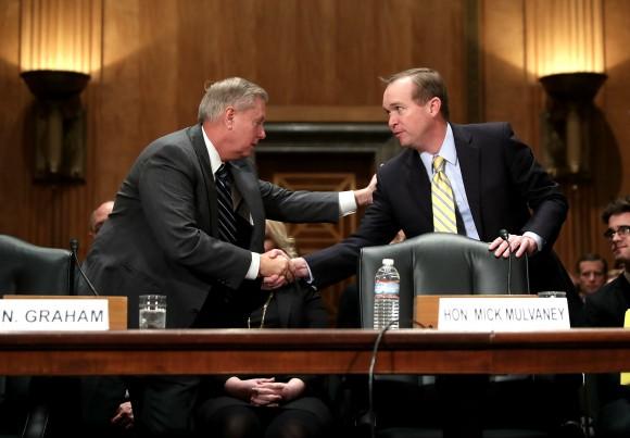 Sen. Lindsey Graham (R-SC) (L) shakes hands with Rep. Mick Mulvaney (R-SC) after introducing him before the Senate Homeland Security and Governmental Affairs Committee during Mulvaney's confirmation hearing to be the next director of the Office of Management and Budget in the Dirksen Senate Office Building on Capitol Hill in Washington on Jan. 24, 2017. A conservative Republican from South Carolina, Mulvaney was nominated by U.S. President Donald Trump. (Chip Somodevilla/Getty Images)