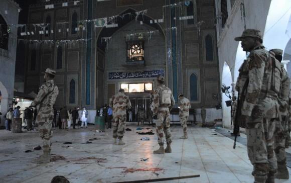 Pakistani para-military soldiers stand alert after a deadly suicide attack at the shrine of famous Sufi Lal Shahbaz Qalandar in Sehwan, Pakistan, on Feb. 16, 2017. (AP Photo/Pervez Masih)
