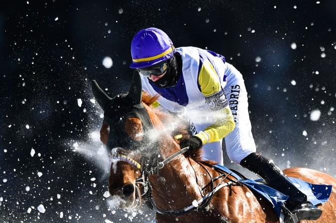Fabris Jindrich with his horse Hello Goodby competes during the flat race of the White Turf horse racing event in St. Moritz, Switzerland, on Feb. 19, 2017.<br/>The races are held on the frozen lake of the Swiss mountain resort. (MICHAEL BUHOLZER/AFP/Getty Images)