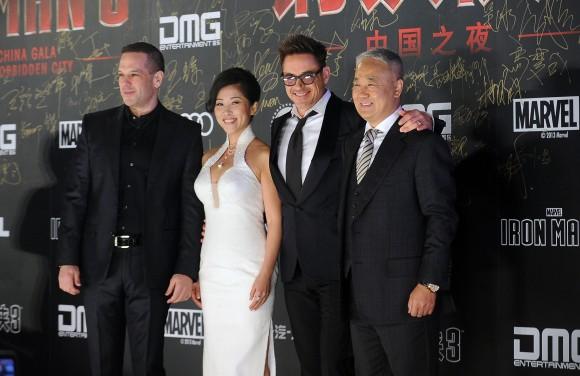 Robert Downey Jr. with CEO of DMG Dan Mintz (L), DMG president Wu Bing (2nd L) and DMG chairman Xiao Wenge (R) as they attend a promotional event for ''Iron Man 3'' in Beijing on April 3, 2013. (WANG ZHAO/AFP/Getty Images)