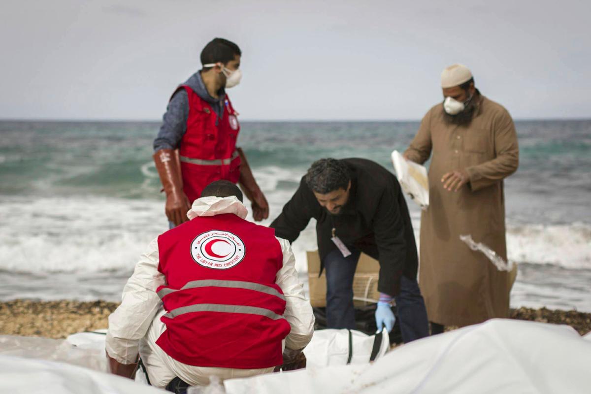 Libyan Red Crescent workers recovering bodies of people that washed ashore, near Zawiya, Libya on Feb. 20, 2017.(Mohannad Karima/IFRC via AP)