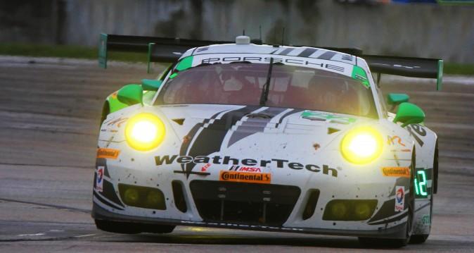 The #22 AJR WetherTech Porsche gets both right-side wheels off the ground rounding Turn 17. (Chris Jasurek/Epoch Times)