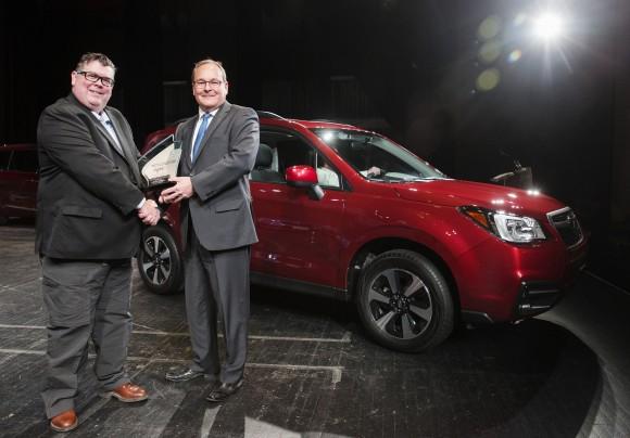 Gary Grant, AJAC Co-Chair (left) poses for a photo with Ted Lalka, vice president, Product Management, Marketing & Customer Experience for Subaru (right) after the Subaru Forester wins the Canadian Utility Vehicle of the Year award in Toronto on February 16. (Courtesy of Michelle Siu/AJAC)