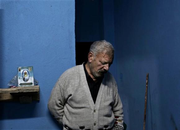 Egyptian Christian Ezzat Yaacoub Ishak, who fled el-Arish in North Sinai with his family two days ago due to fighting, stands in his newly rented apartment, in Ismailia, 120 kilometers (75 miles) east of Cairo, Egypt on Feb. 26, 2017. (AP Photo/Nariman El-Mofty)