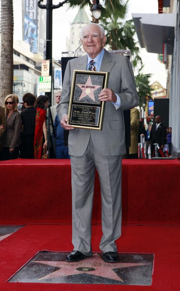 Judge Joseph Wapner is honored with star on the Hollywood Walk of Fame in Los Angeles on Nov. 12, 2009. Wapner, who presided over "The People's Court" with steady force during the heyday of the reality courtroom show, has died. Wapner died at home in his sleep on Feb. 26, 2017, according to his son, David Wapner. (AP Photo/Damian Dovarganes)