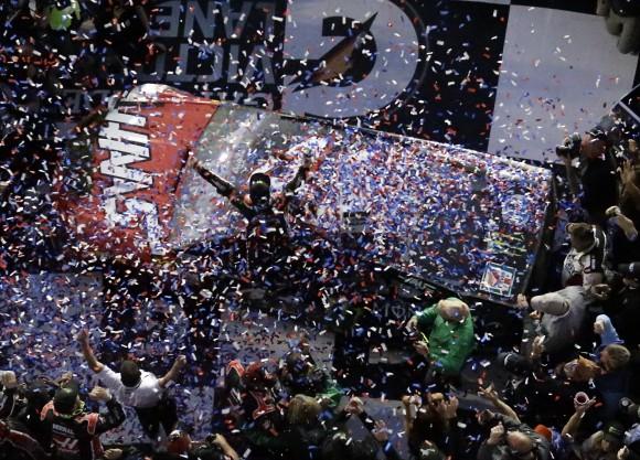 Kurt Busch, center, celebrates in Victory Lane after winning the Daytona 500 auto race at Daytona International Speedway on Feb. 26, 2017, in Daytona Beach, Fla. (AP Photo/John Raoux)