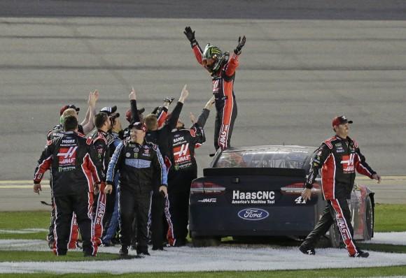 Kurt Busch, top, celebrates with crew members after winning the NASCAR Daytona 500 auto race at Daytona International Speedway in Daytona Beach, Fla. on Feb. 26, 2017. (AP Photo/Terry Renna)