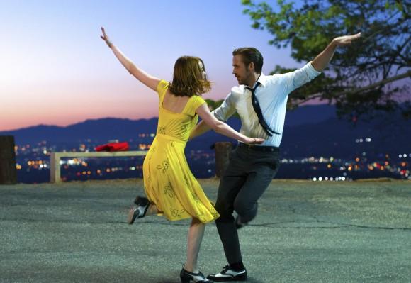 This image released by Lionsgate shows Ryan Gosling, right, and Emma Stone in a scene from, "La La Land." (Dale Robinette/Lionsgate via AP)