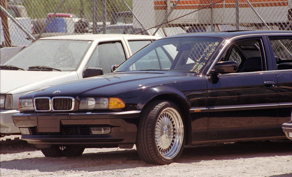 A black BMW, riddled with bullet holes, is seen in a Las Vegas police impound lot on Sept. 8, 1996. (AP Photo/Lennox McLendon, File)