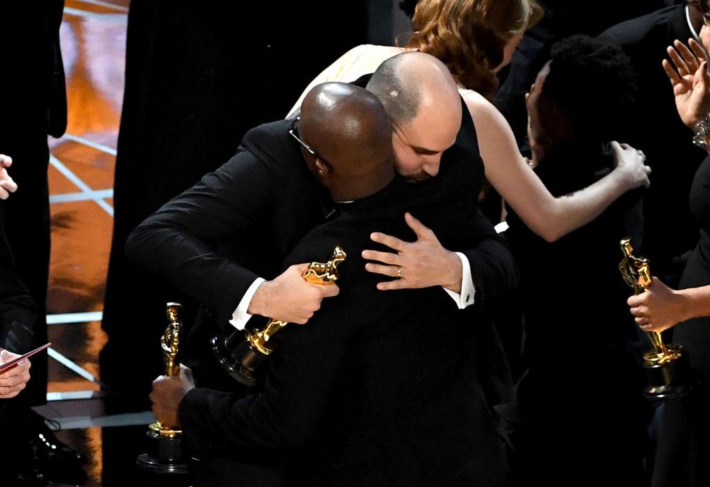 'La La Land' producer Jordan Horowitz (L) hands over the Best Picture award to 'Moonlight' writer/director Barry Jenkins following a presentation error onstage during the 89th Annual Academy Awards at Hollywood & Highland Center in Hollywood, CA., on February 26, 2017. (Kevin Winter/Getty Images)
