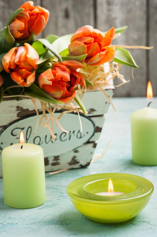 Fresh flowers and tea lights are an easy way to freshen a room and lend a hint of spring. (Irina Bort/Shutterstock)