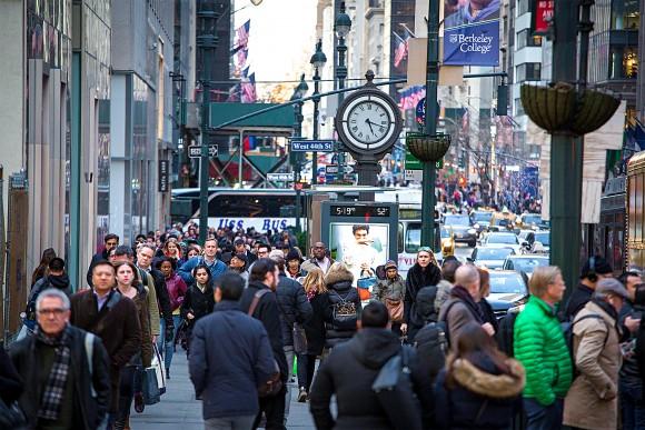 Pedestrians at Fifth Avenue at West 44th Street in New York City, Feb. 28. In October 2014, the New York City Council passed two pieces of legislation to protect illegal aliens, including criminals, from immigration law enforcement. (Samira Bouaou/Epoch Times)