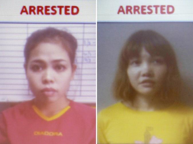 This combination of Feb. 19, 2017, photos released by Royal Malaysia Police shows detained Indonesian suspect Siti Aisyah (L) and detained Vietnamese suspect Doan Thi Huong are displayed on a screen during a press conference at the Bukit Aman national police headquarters in Kuala Lumpur, Malaysia. (Royal Malaysia Police via AP)